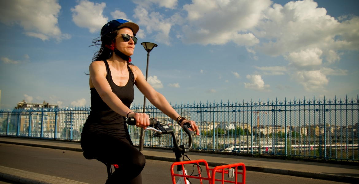 Photograph of a girl on a bicycle in Paris